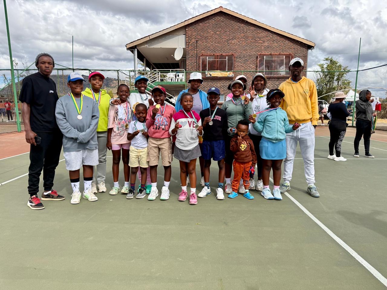 Group of Basotho junior players with their coach